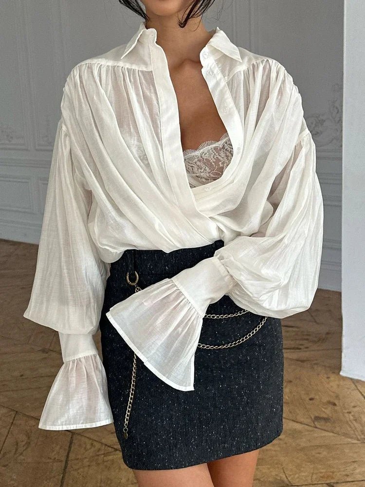Blusa transparente con botones Brielle