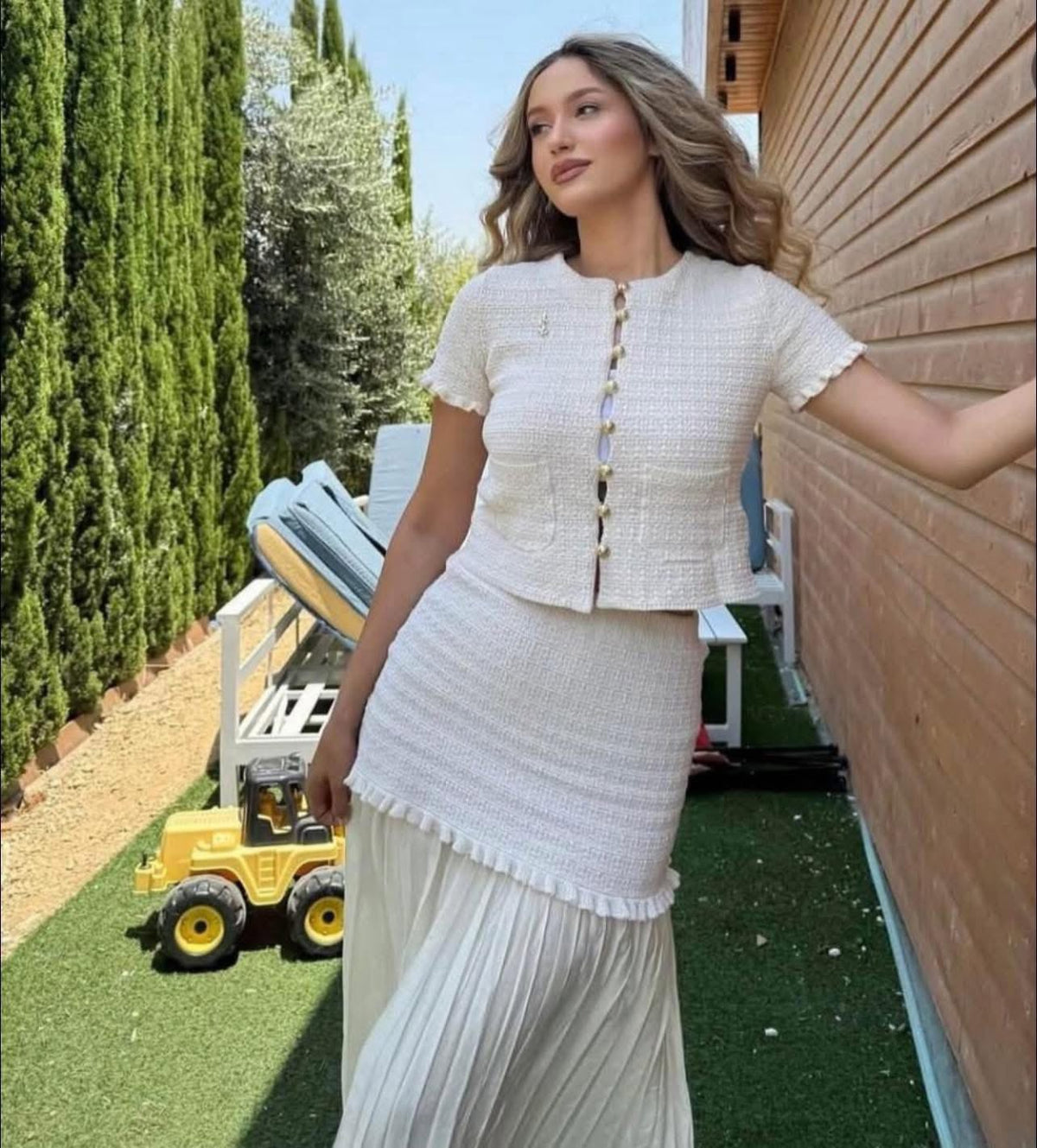 Conjunto Claudia de top de punto de tirantes y falda plisada
