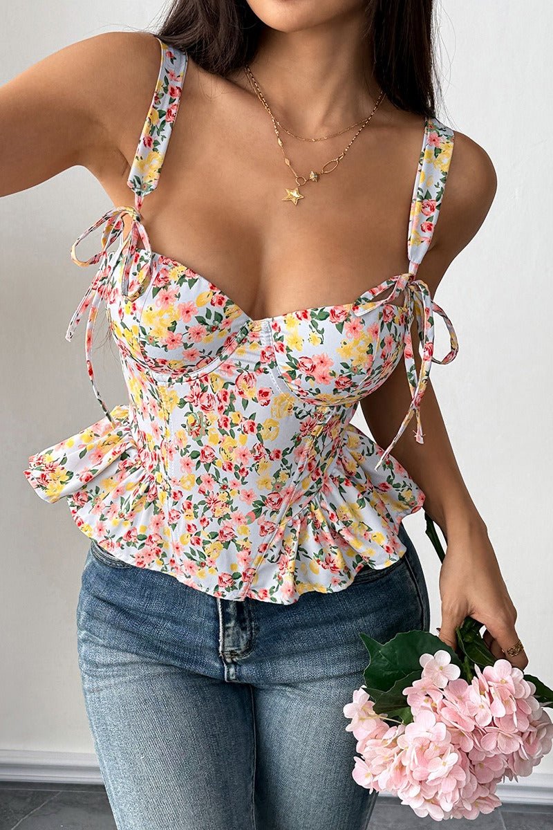 Top de tirantes Elara con peplum floral