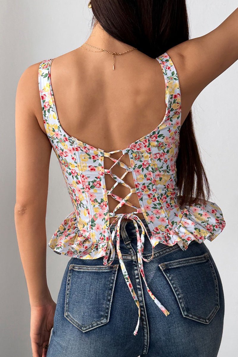 Top de tirantes Elara con peplum floral