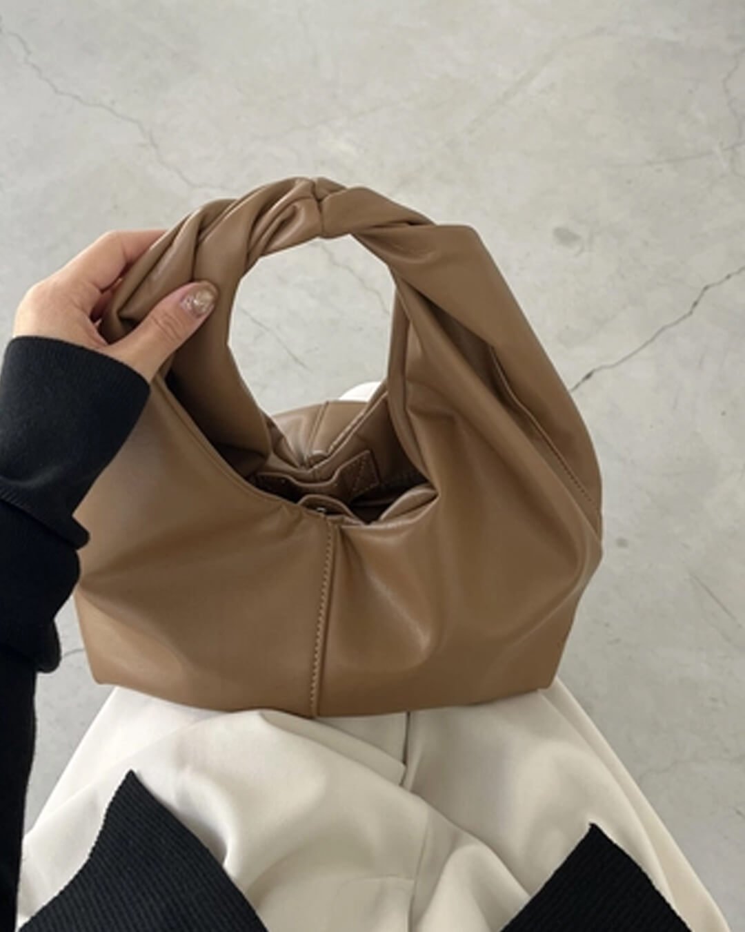 Bolso de mano de cuero Gelyn