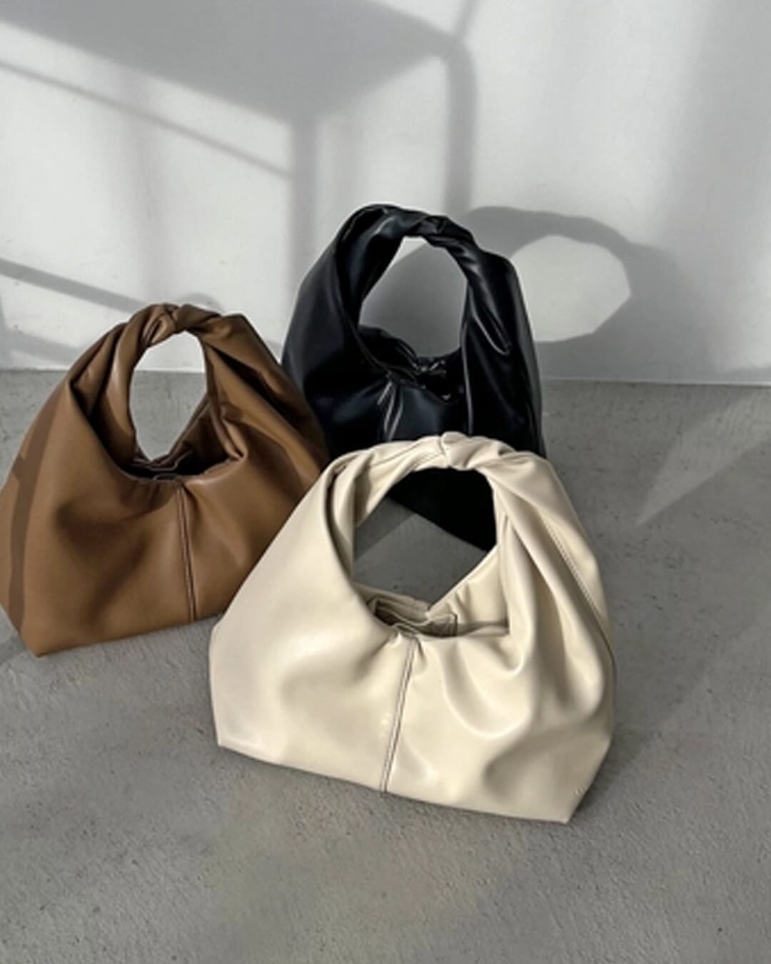 Bolso de mano de cuero Gelyn
