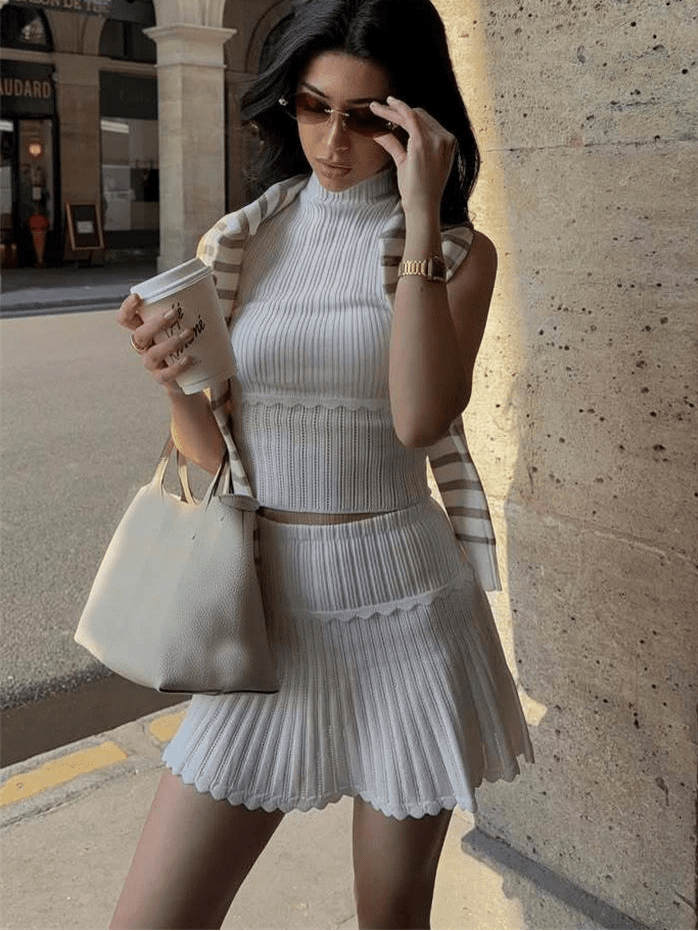 Conjunto de dos piezas de top corto de punto y minifalda plisada Kelly