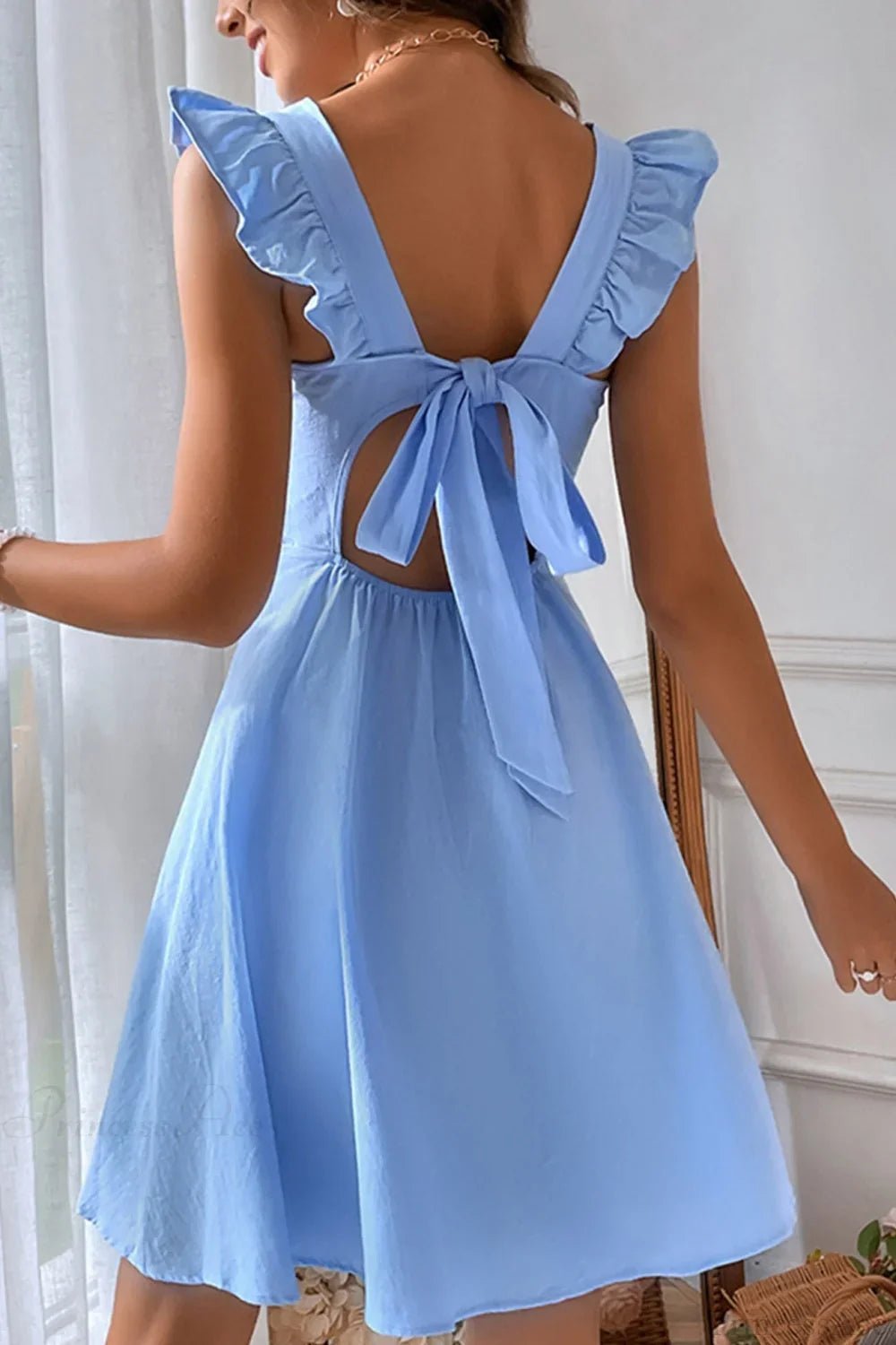 Minivestido sin mangas Nora con volante y lazo trasero