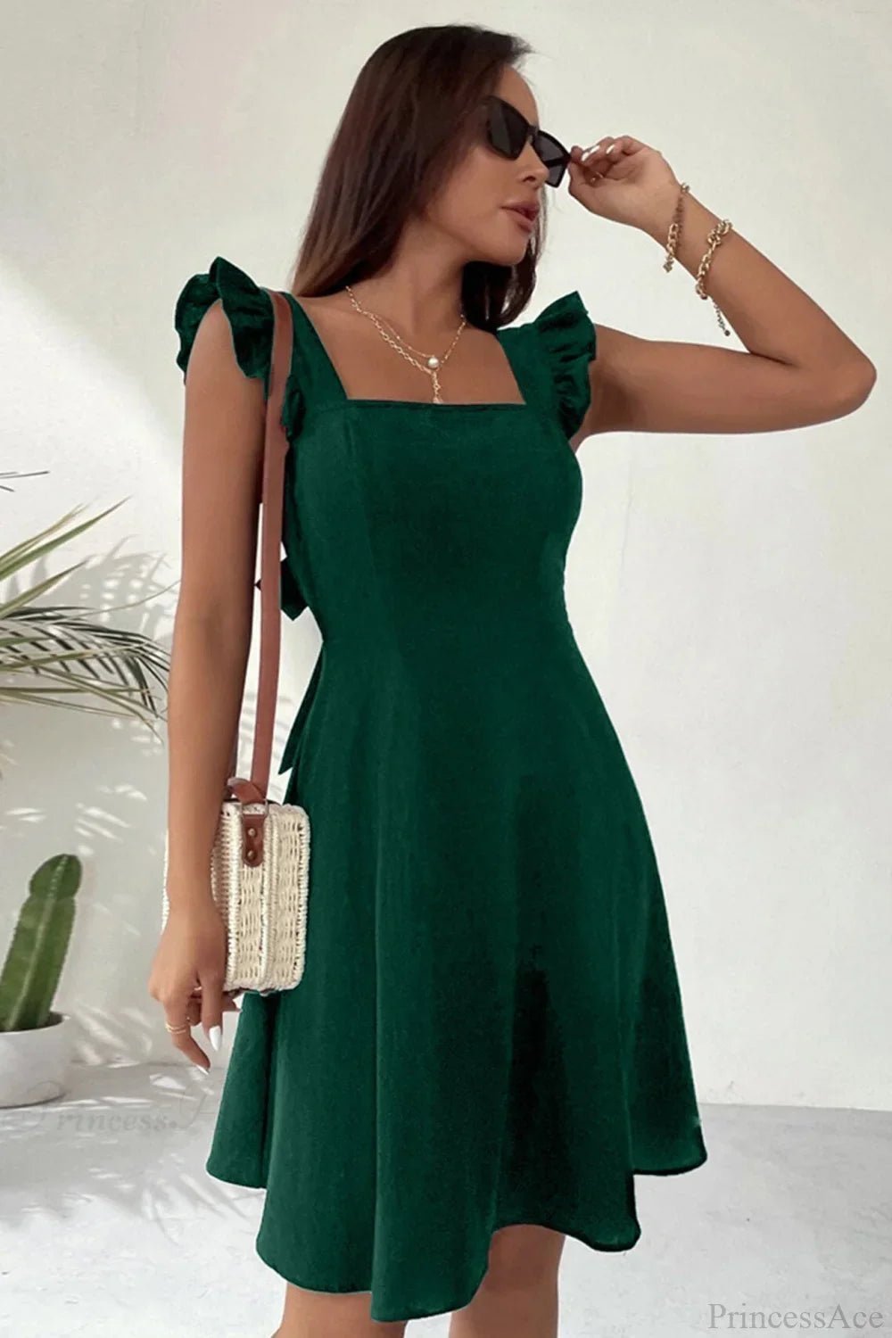 Minivestido sin mangas Nora con volante y lazo trasero
