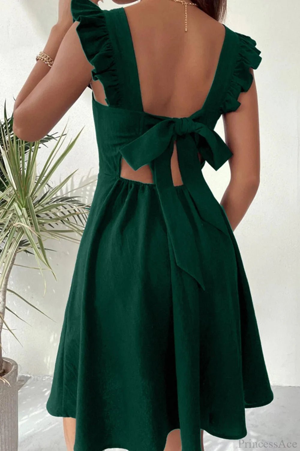 Minivestido sin mangas Nora con volante y lazo trasero