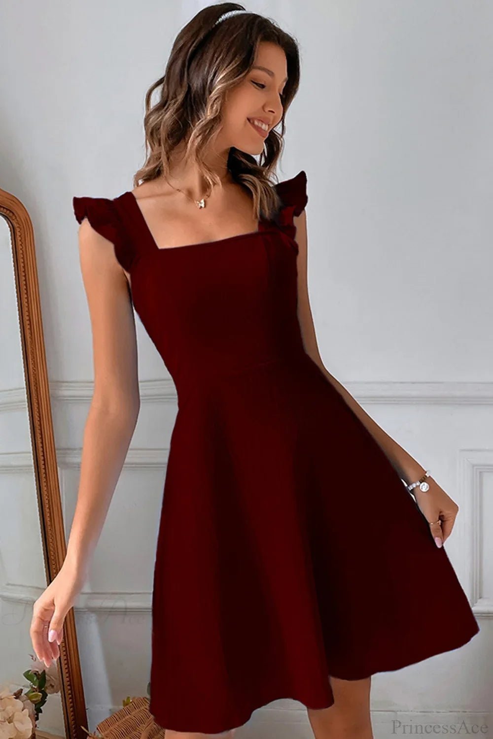 Minivestido sin mangas Nora con volante y lazo trasero