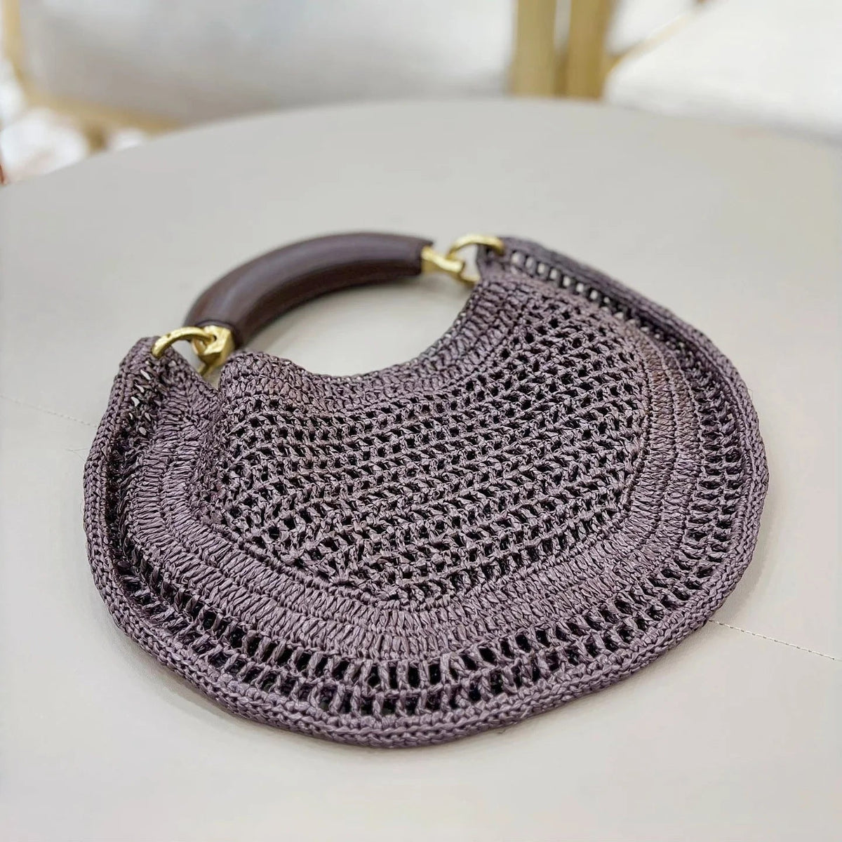 Bolso tejido de media luna Sabine
