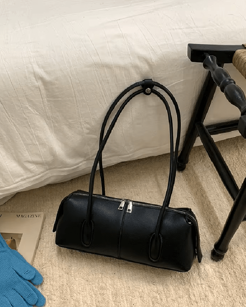 Mira Cylinder Shoulder Bag in black – styled look