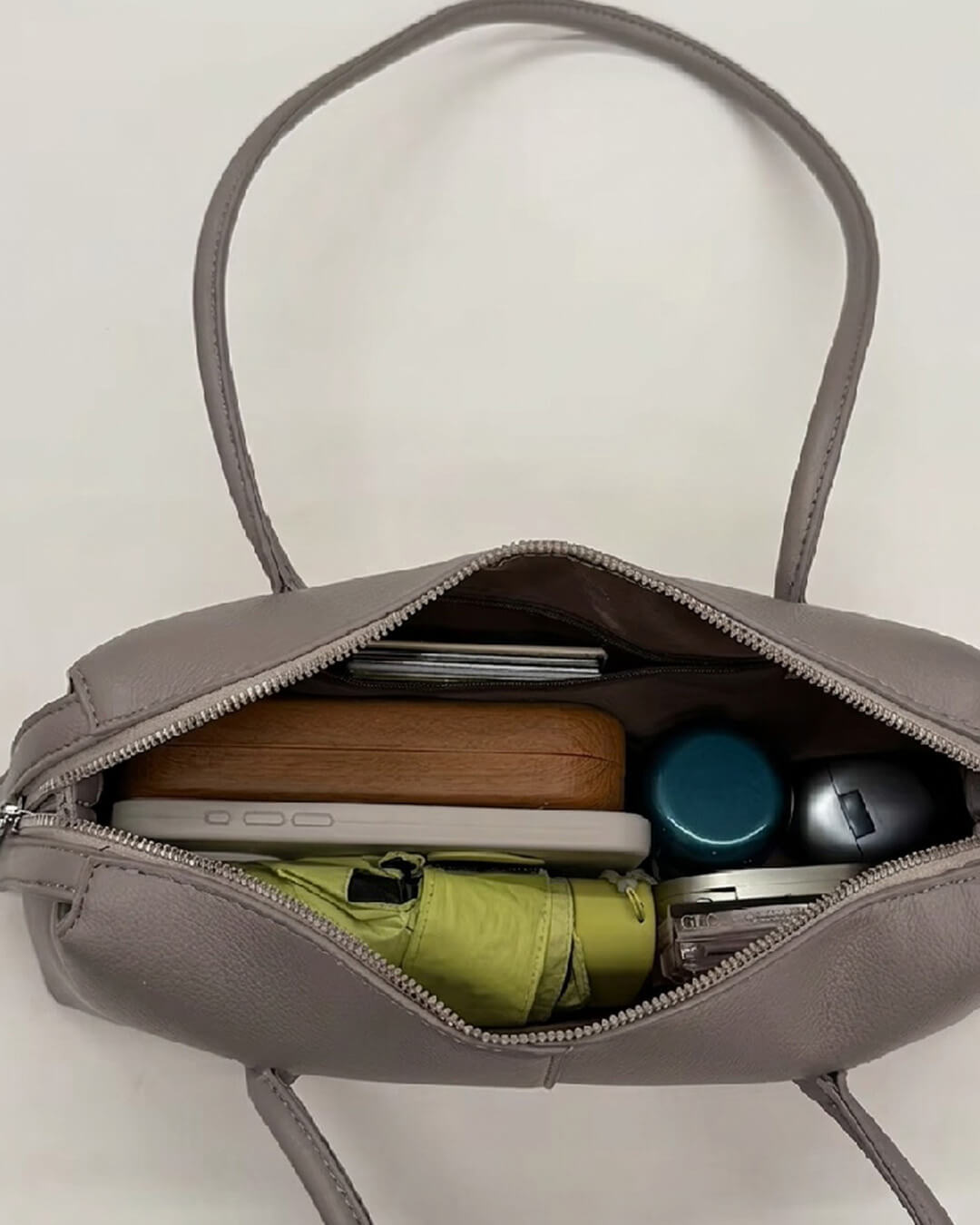 Mira Cylinder Shoulder Bag in taupe grey – styled look
